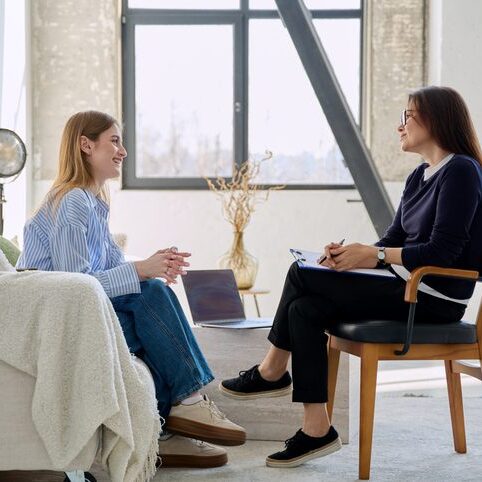 Young woman patient during therapy session in professional mental therapist counsellor office. Psychological social services, counseling psychology psychotherapy help treatment support youth concept