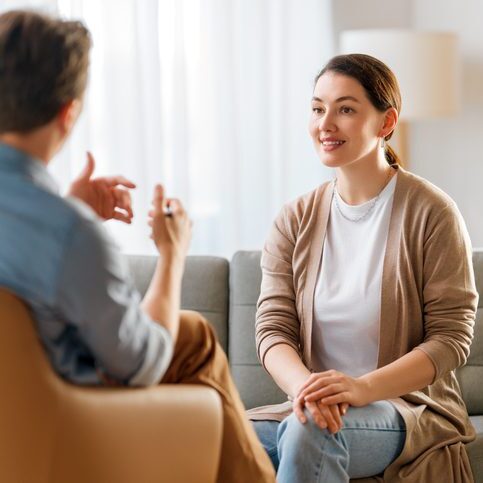Consultation of young female patient on reception for psychologist.