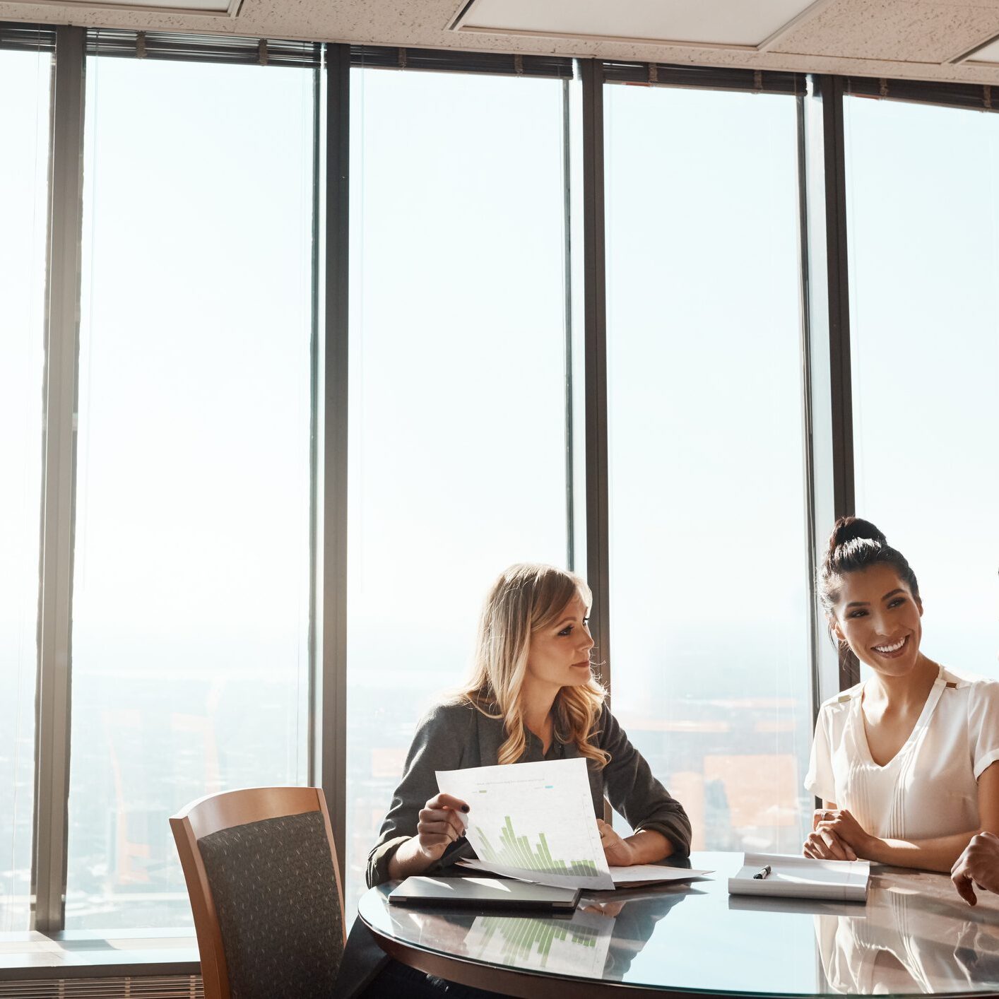 Shot of a young couple meeting with a financial planner in a modern office